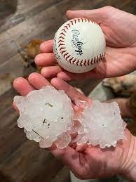 sized hail stone, huge hail stone, texas hail, roofing company in austin, roof repair texas hill country, roof replacement georgetown texas, hail damage experts, commercial hail restoration experts