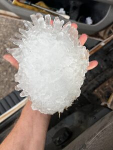 softball sized hail stone, large hail stone, hail austin, austin texas, hail damage experts, commercial hail restoration experts, dripping springs roofer, dripping springs roofing company